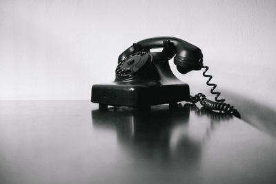 Close-up of telephone on table