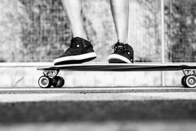 Low section of man skateboarding