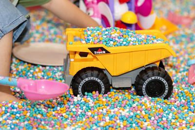 Midsection of woman holding toy blocks