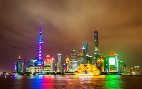 Illuminated buildings in city at night