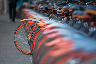 Close-up of bicycle parked on street in city