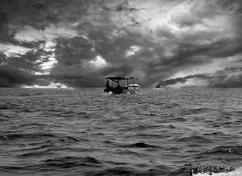 Scenic view of sea against cloudy sky