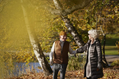 Senior couple in autumn scenery