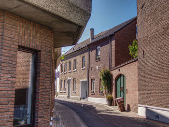 Street amidst buildings against sky