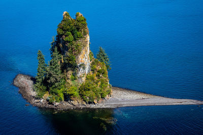 High angle view of rocks by sea