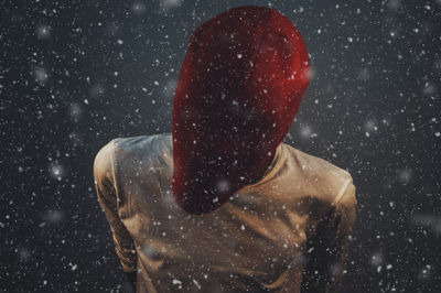 Rear view of a man in snow