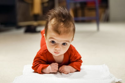 Portrait of cute baby girl at home