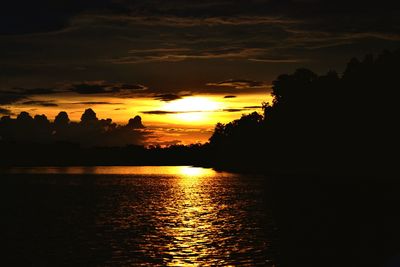 Scenic view of sea against romantic sky at sunset