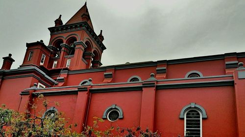 Low angle view of red building against sky