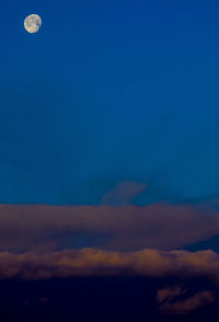 Low angle view of moon at sunset