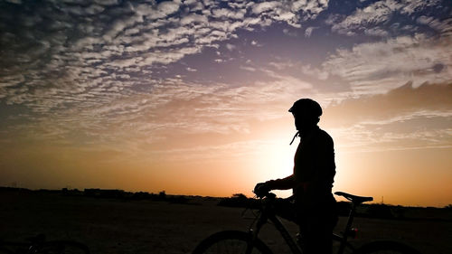 Silhouette of person at sunset