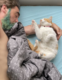 Full length of man and cat