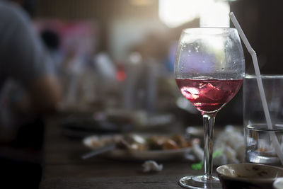 Glass of wine on table at the lunch time