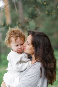 Mother and daughter outdoors