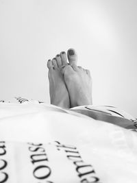 Low section of woman lying on floor