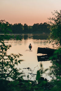 Scenic view of lake against sky during sunset