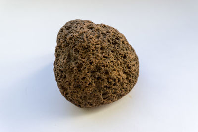 Close-up of bread against white background