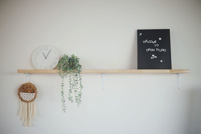 Close-up of decor on shelf at home