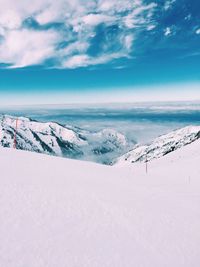 Scenic view of landscape against sky during winter