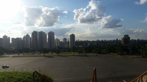 Skyscrapers against cloudy sky