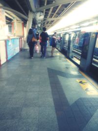 People walking on subway platform
