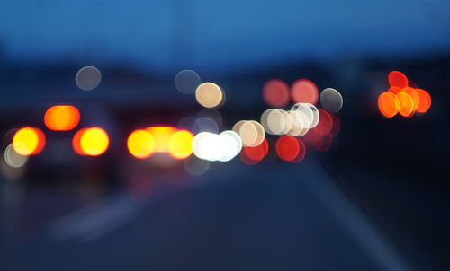 Defocused image of illuminated city at night