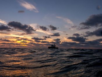 Scenic view of sea at sunset
