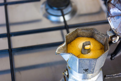 Close-up of coffee maker on stove