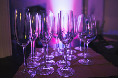 Close-up of wine glasses on table