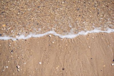 Close-up of snow on beach