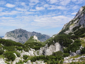 Scenic view of mountains against cloudy sky