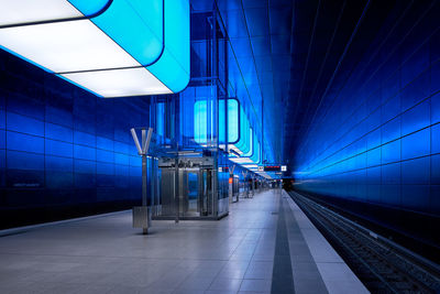 Illuminated railroad station in city