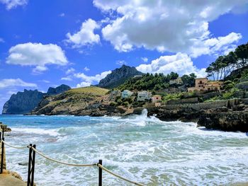 Scenic view of sea against cloudy sky