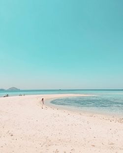 Scenic view of beach against clear sky