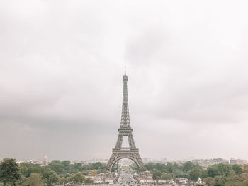 Tower against cloudy sky