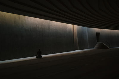 A man prays in the underground mosque