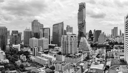 Modern buildings in city against sky