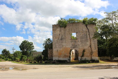 Old building against cloudy sky