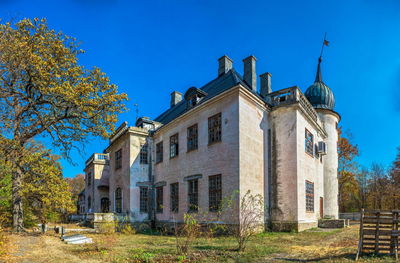 Low angle view of building against blue sky