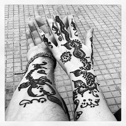 Close-up of woman standing on tiled floor