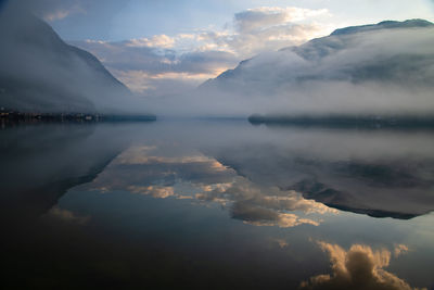 Scenic view of lake against sky during sunset