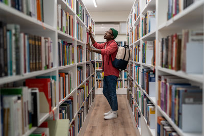 Portrait of woman standing in library