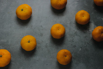 High angle view of orange fruits on table