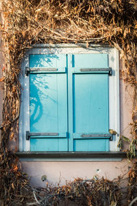 Closed window of abandoned building