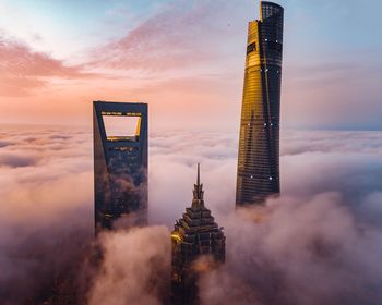 Building against cloudy sky during sunset