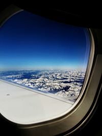 Aerial view of landscape seen through airplane window