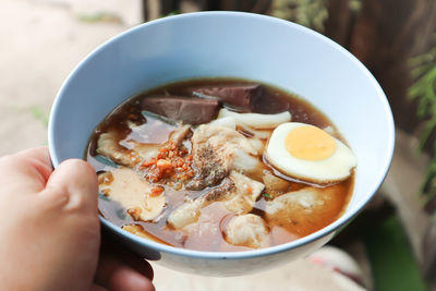 Close-up of person holding food