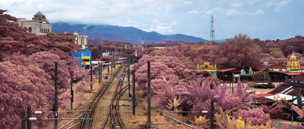 High angle view of trees and mountains against sky