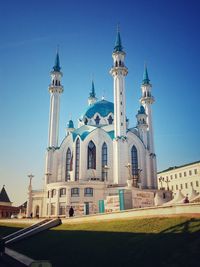 Kul sharif mosque in the kazan kremlin. a majestic white stone mosque under blue summer sky.