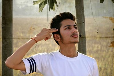 Portrait of young man looking away